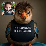 A cute toddler with curly hair and big blue eyes sits in a colorful baby activity seat, wearing a black bib that humorously reads 'MY RAP NAME IS LIL' HANGRY'. The background shows baby bottles and toys, adding to the playful and cozy atmosphere.