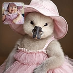 A chubby-cheeked baby dressed in a frilly pink dress and matching hat smiles gently at the camera, radiating pure cuteness and innocence in a soft-focus setting.
