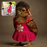 A cheerful toddler in a bright pink dress with a big daisy print is caught mid-step on a shiny marble floor, looking down with a shy smile while the background shows a lush garden and a sunlit patio.