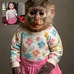 A cute little girl with a messy face from spaghetti sauce stands confidently on a chair in a cozy kitchen, while a blurred boy reaches out near the table with a bowl of half-eaten spaghetti in the foreground.