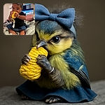 A cute baby wearing a big blue bow headband is sitting on a cozy blanket, chewing on a yellow knitted toy with intense concentration. The background shows a softly blurred room with a TV screen and some household items.