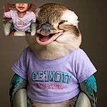 A joyful toddler with a scrunched-up smile is sitting comfortably in a baby seat, wearing a colorful Ocean City Maryland t-shirt, radiating pure happiness and mischief.