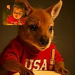 A curious toddler in a red shirt is captivated by the warm glow of a yellow light source, their wide eyes and slightly parted lips expressing wonder and amazement in a cozy, dimly lit setting.