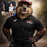 A cheerful man in sports attire stands proudly next to a young girl dressed in athletic clothing, both posing outdoors on a sunny day with a backdrop featuring the Goanna Academy logo. The man has his arm around the girl, who looks ready for some sporting action, while a person in the background adds a casual vibe.