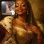 A close-up selfie of a smiling woman with bright yellow eyeshadow and long lashes holding a baby who looks curiously at the camera, with a loving text overlay that says 'She just loves me so much' and a heart-eyes emoji.