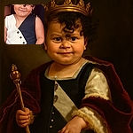 A charming toddler with a mischievous smile sports a stylish black and white outfit, complete with a cute curl falling over their forehead and a golden necklace, sitting comfortably with a hand resting nearby.