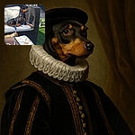 A poised black and tan dog lounges elegantly on a cushioned wicker chair outdoors, basking in the sunlight with a confident gaze. The scene includes a floral tablecloth and a glimpse of people and greenery in the background, creating a relaxed and sunny patio vibe.