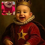 A joyful baby in a bright red onesie with a yellow star and humorous text is grinning widely, showing pure happiness. The background features striped bedding, making the baby the clear focus of this candid and heartwarming moment.