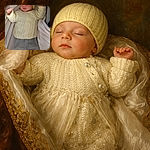 A tiny snooze champion bundled in a pale yellow knitted hat and sweater, sprawled comfortably on a cloud of blankets with little fists mid-dream — clearly auditioning for 'Most Adorable Nap'.