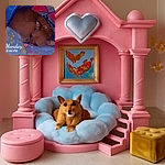 A small brown dog curled up cozily on a soft, colorful blanket inside a blue enclosure, looking sleepy and snug with a heart emoji and the word 'Monday' timestamped on the image, surrounded by tiny star-like sparkles.