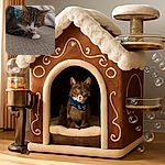 A cozy tabby cat with a festive blue bandana featuring snowflakes lounges on a textured fabric surface, surrounded by soft, rumpled blankets, looking contemplative and ready for a catnap.