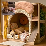 A cozy scene featuring a small brown dog peacefully napping on a textured beige couch, partially covered by a colorful crocheted blanket. The background shows a warm, homey setting with cushions, a mustard yellow throw, and a shelf filled with various items, all bathed in soft, natural light.
