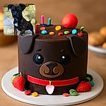 A small dark-colored puppy with a white patch on its chest stands on a tiled floor, looking up with curious eyes. The photo is grainy and slightly blurry, giving it a vintage or low-light feel.