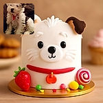 A fluffy little puppy with a red collar and tag sits adorably on a dark quilted blanket, looking slightly off to the side with a curious expression.