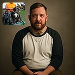 A man in a bright orange sleeveless shirt and camo pants sits on a green Bob-Cat lawn mower with a large black and white dog sitting on his lap, tongue out in a humorous and relaxed pose. The background shows a white trailer and some outdoor equipment, giving a casual, rural vibe.