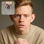 A close-up photo of a French Bulldog with striking blue eyes looking up with a slightly grumpy expression, standing on a tiled floor. The dog's wrinkled face and underbite add a charmingly comical vibe to the image.