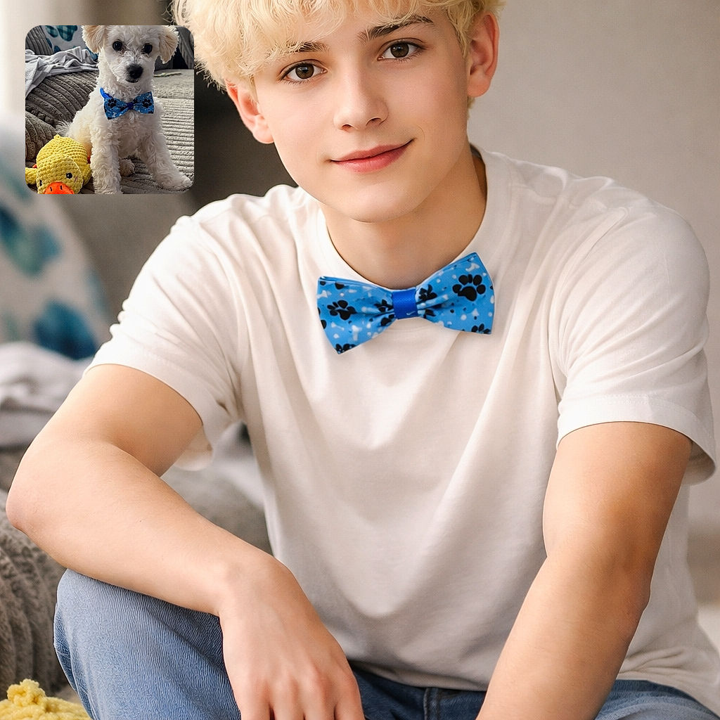 A fluffy white puppy sporting a blue paw-print bow tie sits proudly on a textured gray blanket next to a bright yellow plush duck toy, all set in a cozy living room with soft natural light filtering through window blinds.