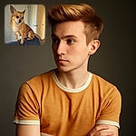 A small tan dog with large, expressive eyes sits perched on the back of a blue couch, looking off to the side with a thoughtful expression. The background shows a softly lit room with white doors and neutral walls, giving a cozy indoor vibe.