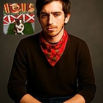 A charming dog wearing a festive red bandana sits attentively on a patch of green grass, with a colorful holiday backdrop featuring cartoon reindeer wearing Santa hats adding a cheerful Christmas vibe.