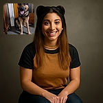A happy German Shepherd dog sits indoors with its tongue out, looking excited and ready for a game of fetch, surrounded by a cozy home setting with wooden furniture and tiled floor.