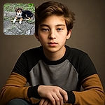 A fluffy puppy lounges on a stone-paved ground, gripping a stick like it's the ultimate treasure. The green garden backdrop adds a natural charm while the pup's curious eyes and soft fur invite endless cuddles.