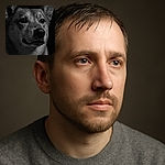 A striking black and white close-up portrait of a wet dog, with water droplets glistening on its fur, staring intently into the distance against a pitch-black background, showcasing detailed texture and soulful eyes.
