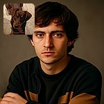 A charming brown and tan dog looking up with curious eyes while sitting on a textured stone floor, casting a soft shadow nearby.