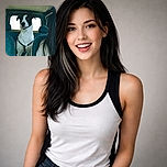 A cheerful black-and-white dog stands in the back of a car like it's the designated co-pilot: tongue slightly out, harness on, ears perked, and eyes scanning the horizon through the window while a human with long hair sits partially in frame. The interior upholstery and headrests frame the pooch, giving serious road-trip vibes and approximately zero concern about backseat snacks.