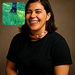 A happy Rottweiler dog with a colorful collar sits proudly in a lush green field of tall grass, tongue out and looking content in the bright daylight.