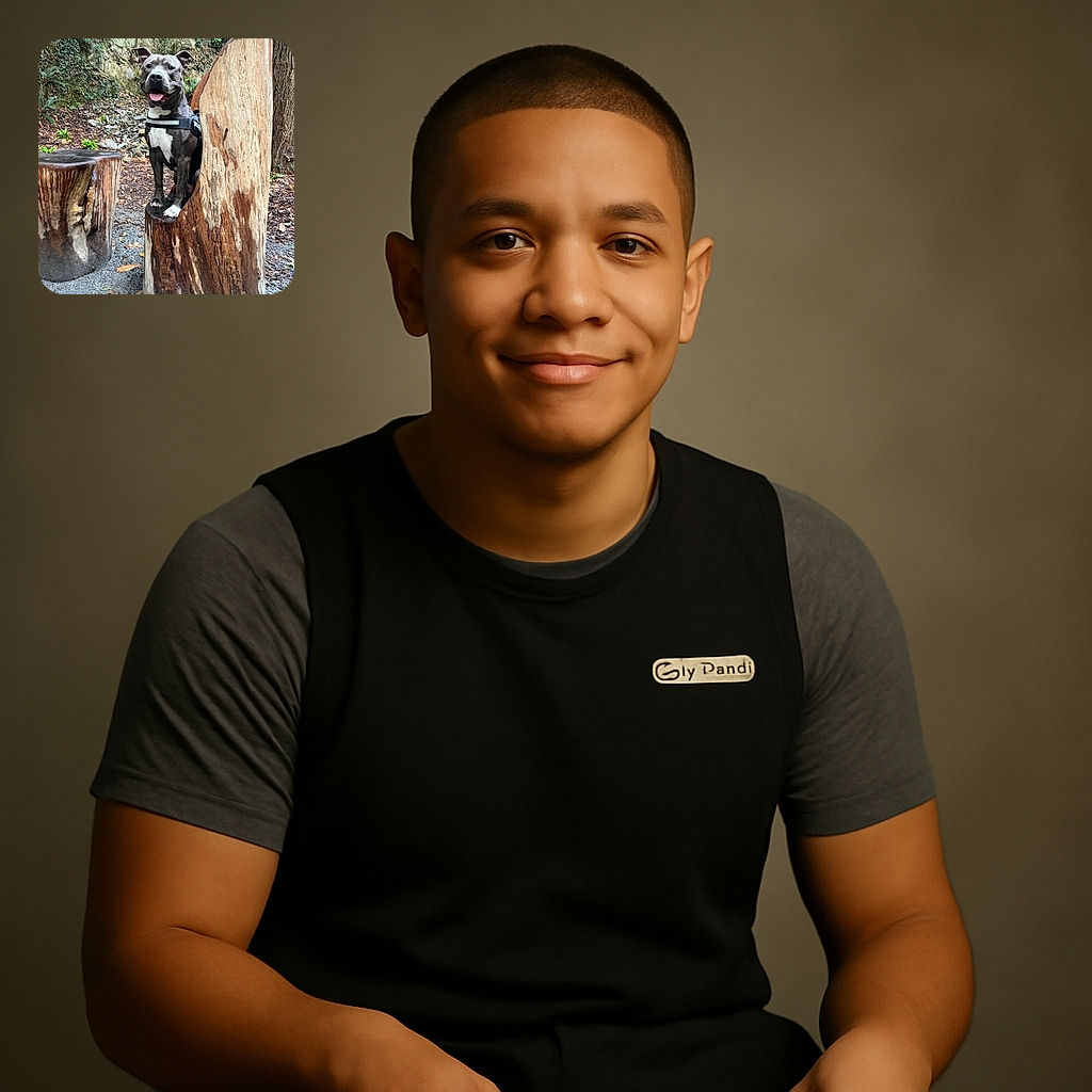 A happy dog with a shiny coat and a harness is perched like royalty on a carved wooden stump throne in a forest setting, tongue out and looking ready to rule the woodland kingdom.