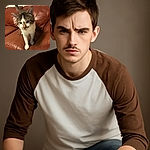 A curious tabby cat with white paws and chest is standing on a worn brown leather couch, looking slightly blurred as if caught mid-step or mid-meow, with a cozy indoor background.