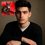 A sleek black and white cat lounges gracefully on a bright red textured blanket, its green eyes wide open and alert, as if contemplating a secret feline mission.