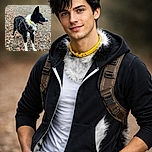 A lively black and white dog wearing a brown harness and a yellow collar stands alert on a ground covered with dry autumn leaves, tongue out, looking off to the side as if ready for an adventure in the crisp fall air.