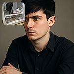 A curious black cat explores the inside of a messy refrigerator, looking slightly confused about the chilly new territory. The fridge shelves are cluttered and stained, adding a humorous touch to the feline's unexpected adventure.