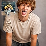 A fluffy dog with a freshly groomed look stands proudly on a platform, tongue out and eyes sparkling with joy. The backdrop is covered with repeated logos and the phrase 'So My Dog,' making it look like a star at a pet photo shoot or a fancy dog event.