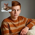 A cozy orange tabby kitten lounges on a fluffy white blanket, gazing off with curious eyes and a soft pink nose, perfectly capturing the essence of feline relaxation in a minimalist setting.