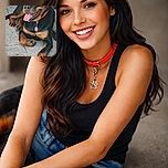 A happy Rottweiler dog lounges comfortably on a stone patio, tongue out and looking content, with a red collar and a tag shaped like a paw. The background features a textured stone wall and some outdoor furniture legs.