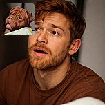 A close-up photo of a wrinkly, expressive brown dog with soulful eyes peeking over a table edge, looking as if it's about to beg for a treat or share some deep doggy wisdom.