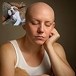 A sleepy dog is lounging on a cozy brown couch, resting its head on its paw as if deep in a peaceful nap, with a relaxed and content expression.