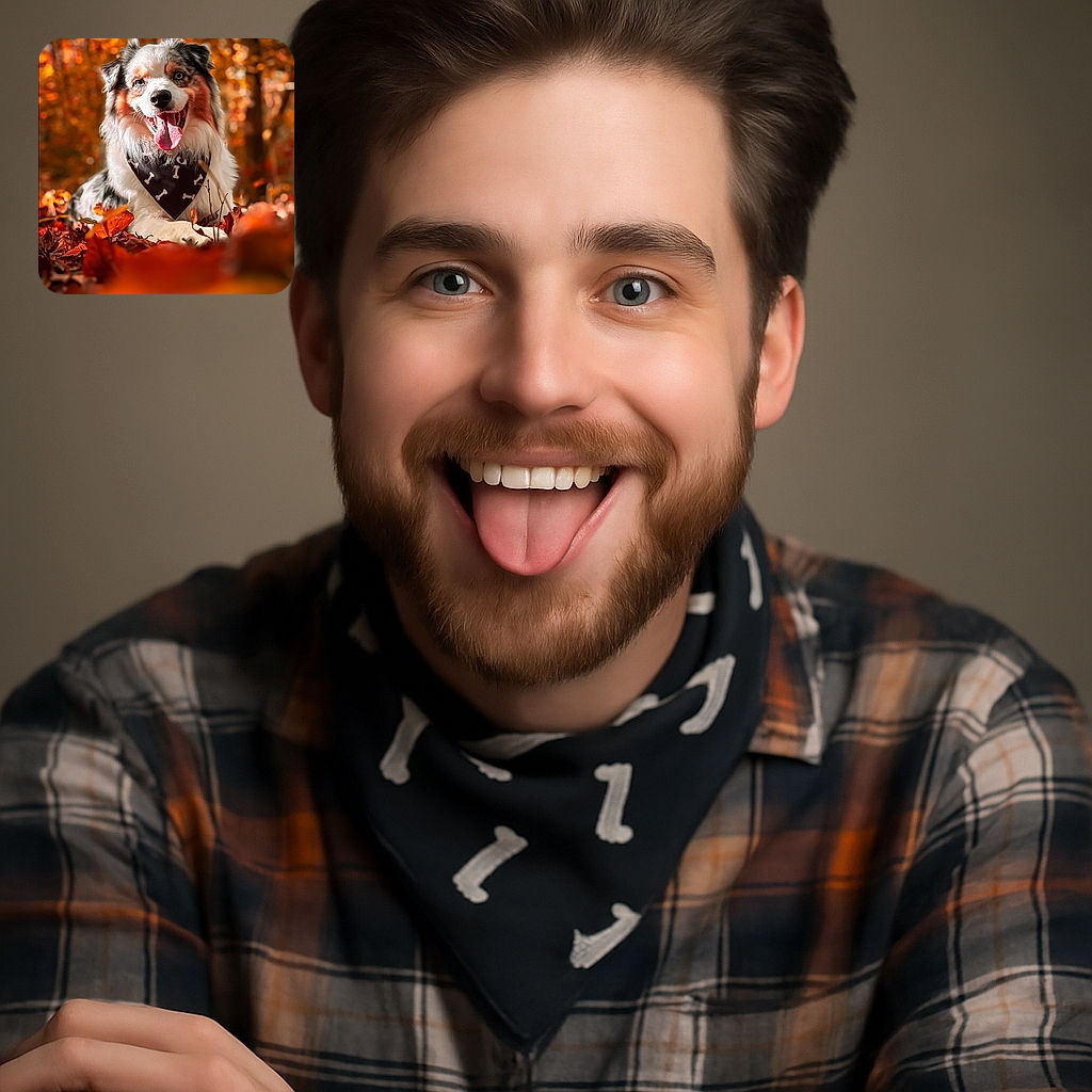A cheerful Australian Shepherd dog lounges amid a carpet of autumn leaves, tongue out and eyes sparkling, wearing a black bandana decorated with white bones. The warm, golden bokeh of fall foliage creates a cozy, vibrant backdrop that perfectly complements the dog's fluffy coat and joyful expression.