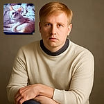 A fluffy white cat lounges comfortably on a rumpled bed with soft lighting highlighting its fur, giving it a serene and cozy vibe.