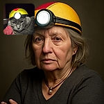 A sleepy gray cat wearing a yellow and red headlamp looks unimpressed while lounging in a cozy spot, ready for a nighttime adventure or maybe just a nap.