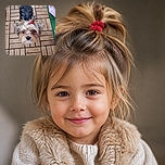 A wonderfully scruffy little dog stares up at the camera like a tiny courtroom judge, its pink topknot adding just the right amount of canine glamour. It sits on a patterned wooden deck beside a strip of green turf, looking ready to issue treats-related legal orders.