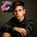 A cozy tabby cat lounges comfortably on a leopard-print blanket, hugging a person's leg like a furry little bodyguard, with a soft blanket in the background adding to the snug vibe.