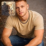 A sturdy brown dog with soulful eyes lies on a patch of dirt and leaves, chained near a fence post. The sunlight casts a shadow across part of its face, giving it a slightly mysterious look as it gazes up at the camera.