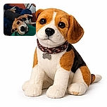 A playful beagle dog lounges comfortably on a cozy blue blanket and red couch, resting its head on a person's green shirt while looking up with soulful eyes, surrounded by soft pillows and a wooden chair in the background.
