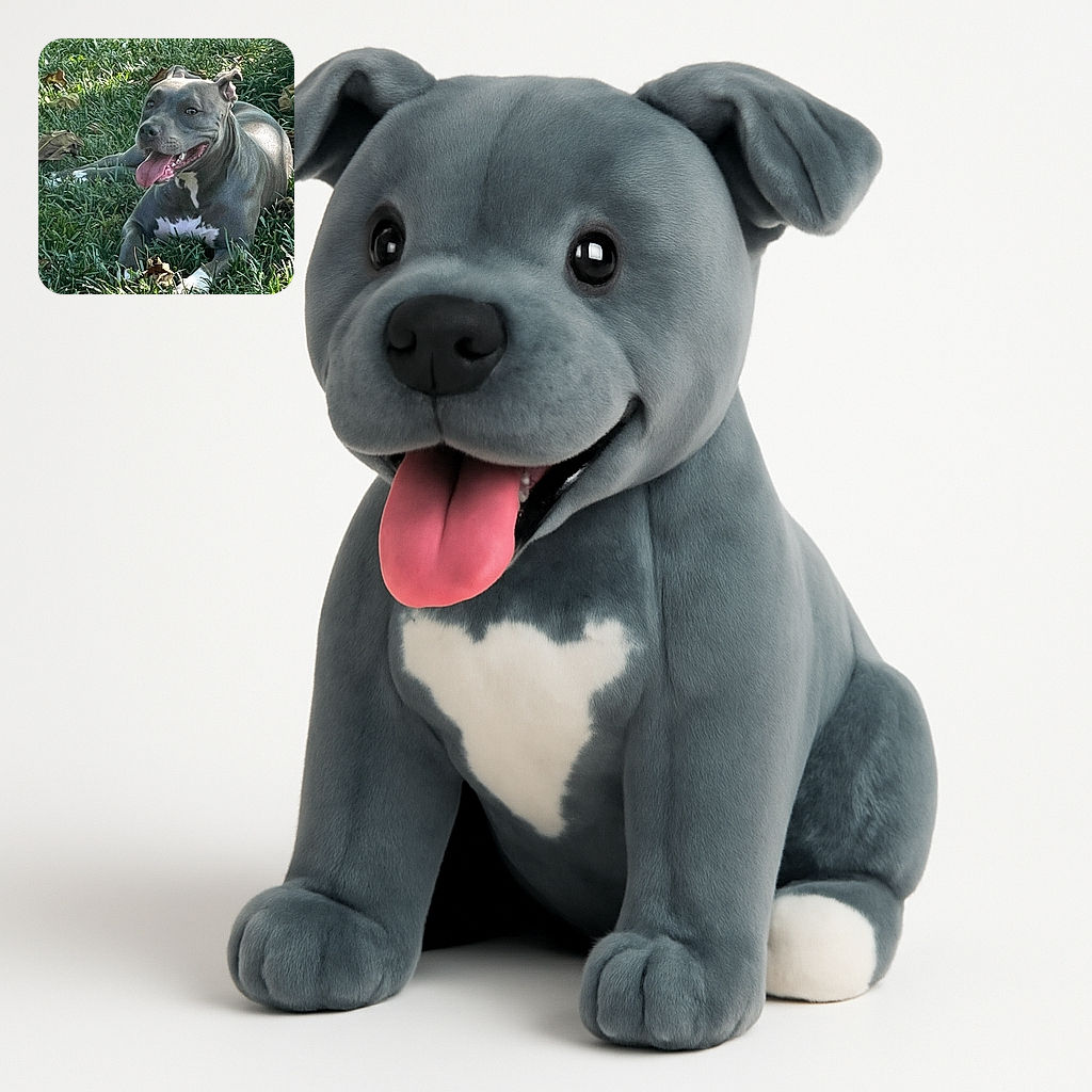 A happy, muscular dog with a shiny grey coat and white chest markings lounges comfortably in the grass, tongue out and ears perked, enjoying a sunny day surrounded by scattered dry leaves.