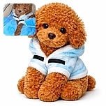 A curly-haired brown puppy snuggled cozily in a soft blue blanket, wearing a cute white outfit, looking adorably sleepy and ready for a nap in a comfy indoor setting.