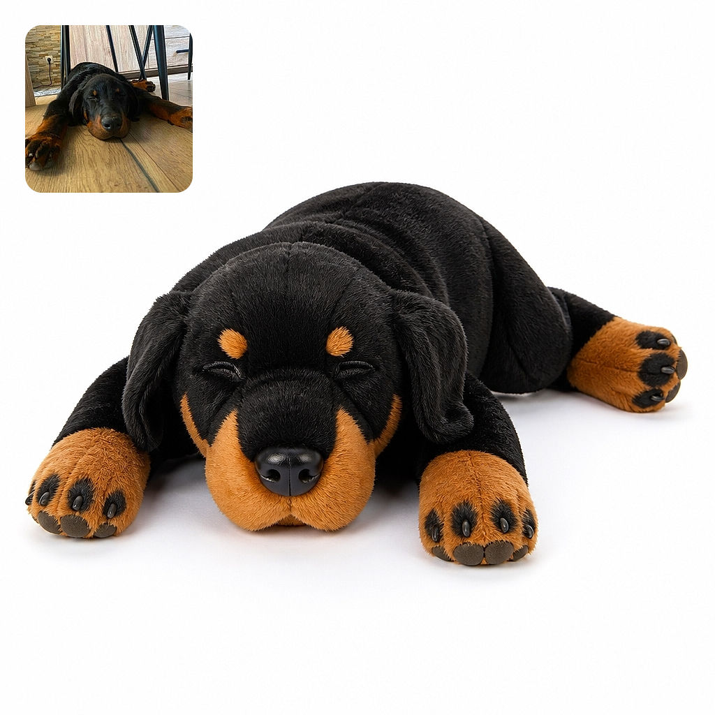 A very sleepy black-and-tan dog sprawls dramatically across the wooden floor beneath a table, looking like the household rug has finally developed paws and demanded a nap.