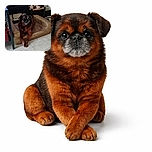 A brown dog lounges comfortably on a well-used dog bed, with a curious expression. Behind it, a large dog statue holds a bone and a wooden sign reading 'THEA.' A TV screen shows a close-up of a person's face in the background, adding an interesting contrast to the cozy scene.